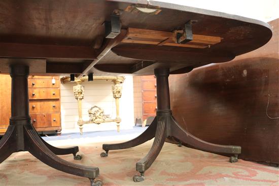 A George III mahogany twin pillar dining table, circa 1800, extends to 12ft 3in. x 5ft 2.5in.